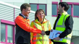 Handshake between three people