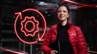 Linde Material Handlingin työntekijä varastossa, taustalla punainen LED-ratassymboli.