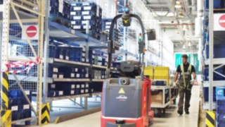 The autonomous P-MATIC tow tractor from Linde Material Handling with geo-navigation in use at Opel-Wien GmbH