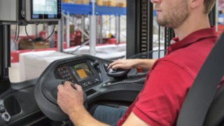 Employee operating the multifunction lever in a Linde Material Handling vehicle